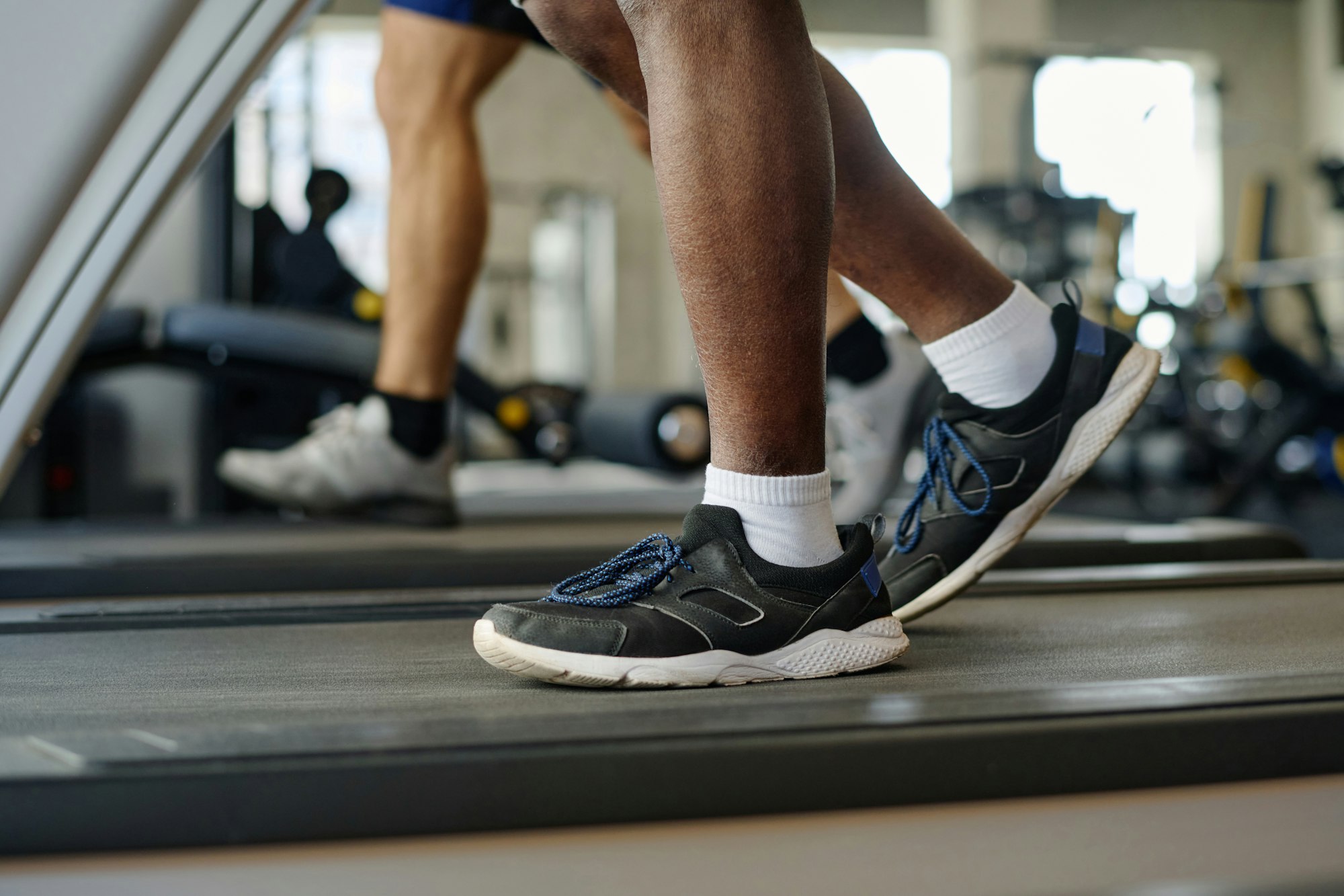 Male Feet Walking on Treadmill